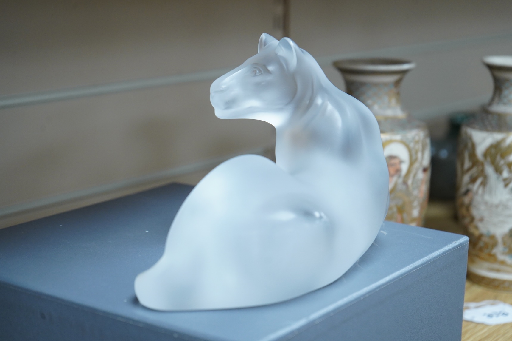 A Lalique glass figure, ‘Simba Lioness’, signed to the base, boxed, 24cm wide